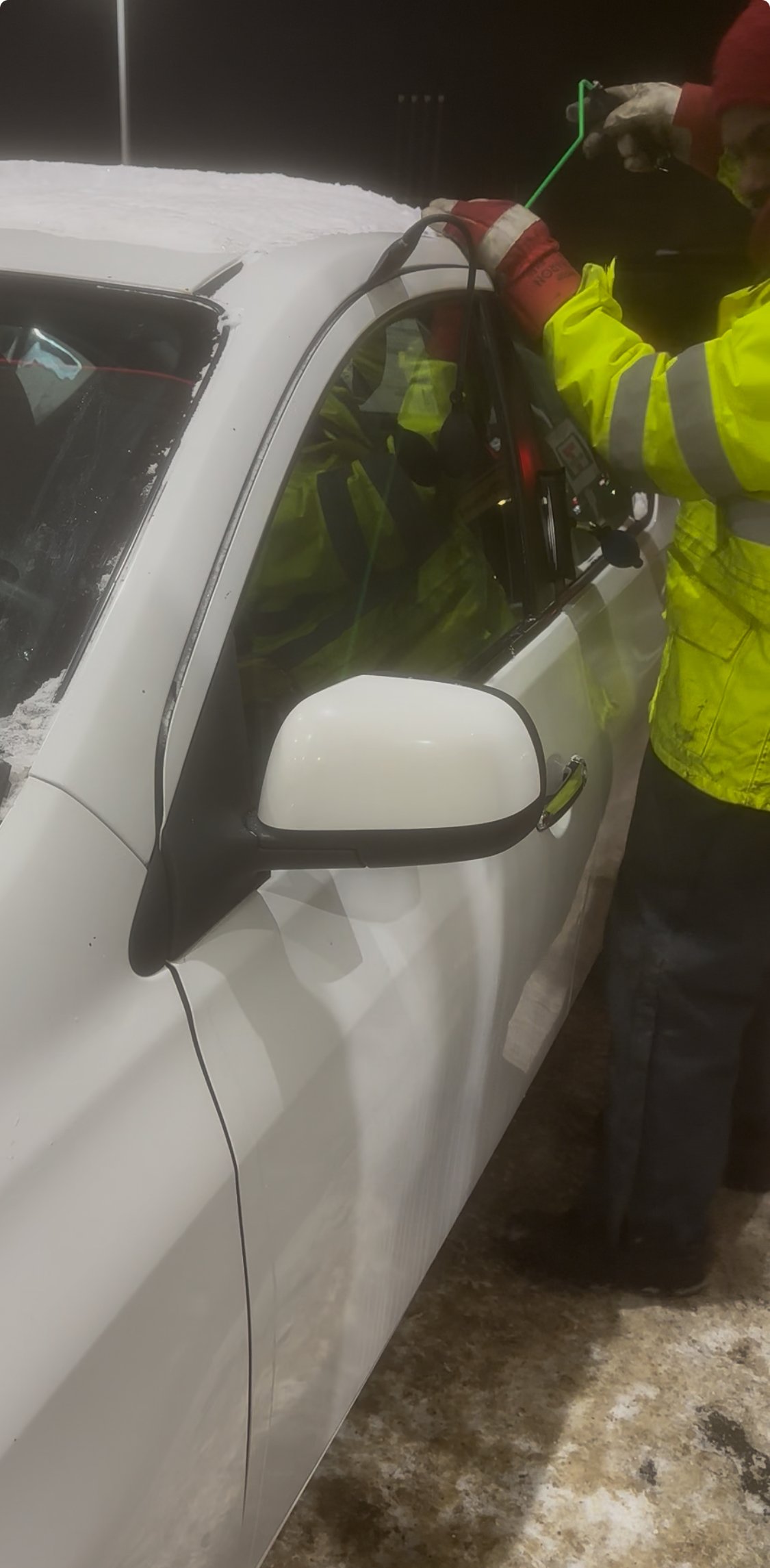 Mhrtab performing a professional car lockout with air-wedge tools in Edmonton