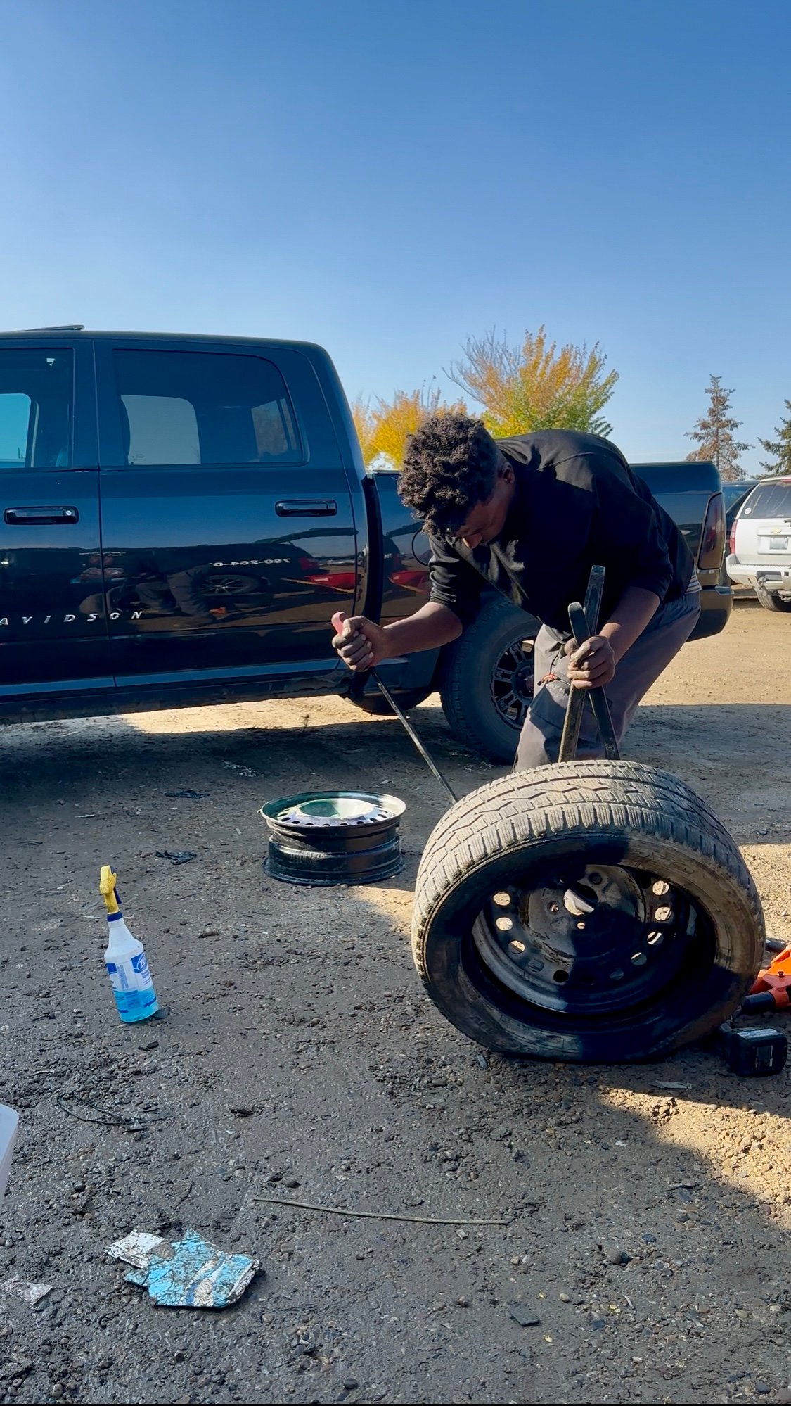 Shakur Roadside mounting a tire on-site in Edmonton