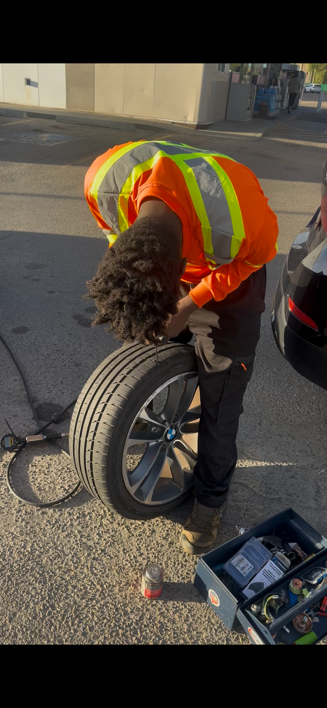 Shakur Roadside performing an on-site tire repair in Edmonton