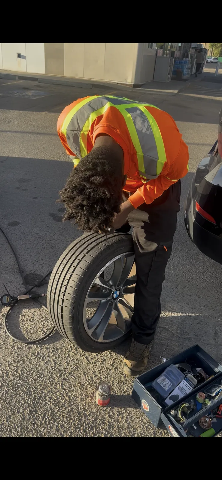 Shakur Roadside performing an on-site tire repair in Edmonton